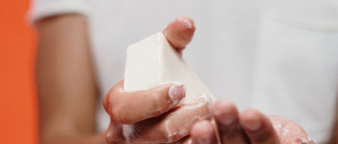 A young person washing their hands