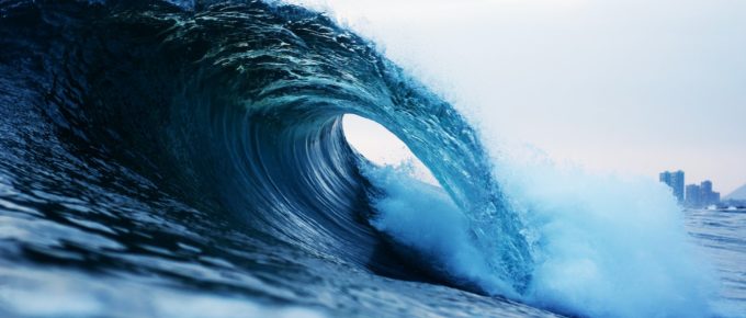 A wave crashing into the ocean.